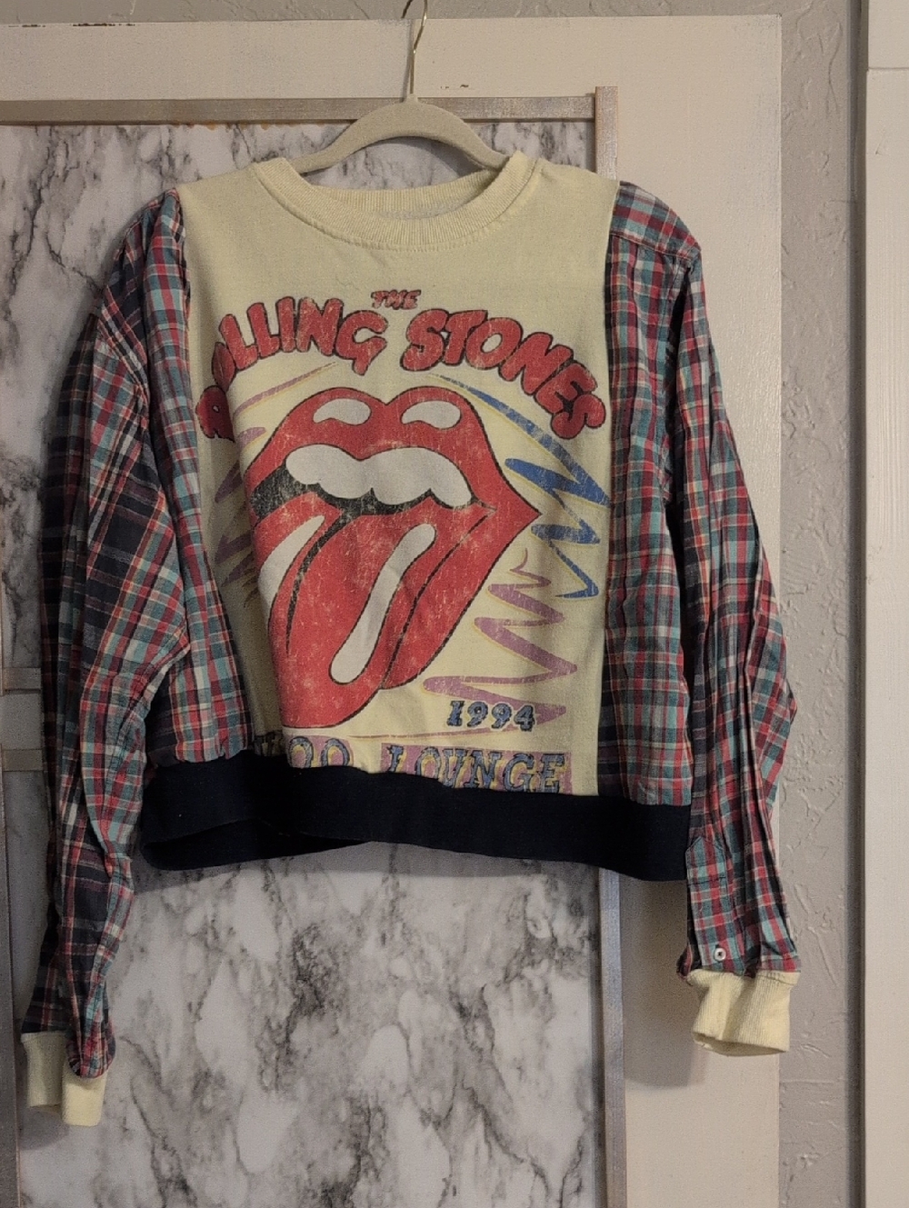 the Rolling Stones Cream Pullover with Red Tongue Graphic & Plaid Sleeves